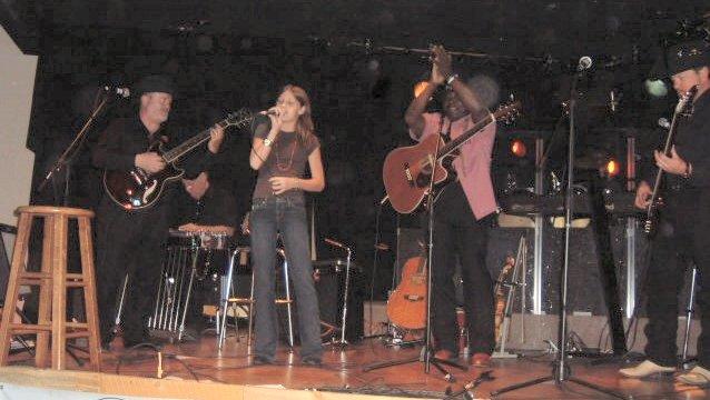 sarahandrudygrant.jpg - Sarah Chlarson singing with Rudy Grant's Band at Doug Kershaw's Bayou Club in Lucern, Colorado.